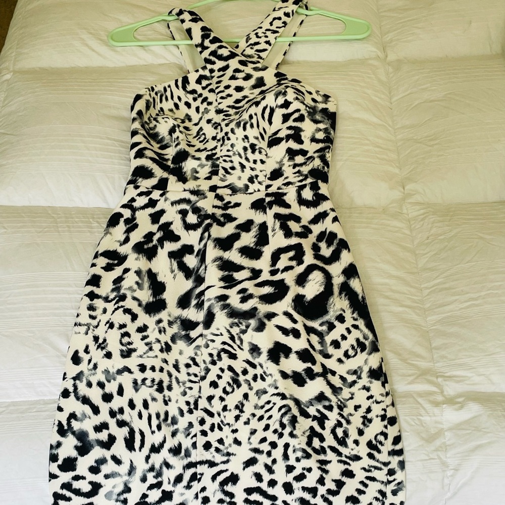 Body hugging, cross strap dress.